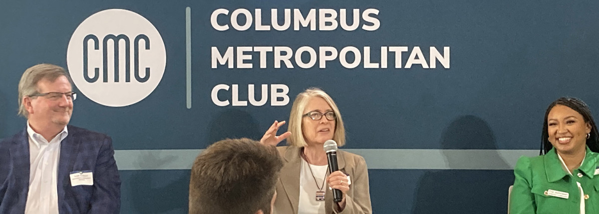 Elena Irwin speaking alongside two fellow panelists at the Columbus Metropolitan Club