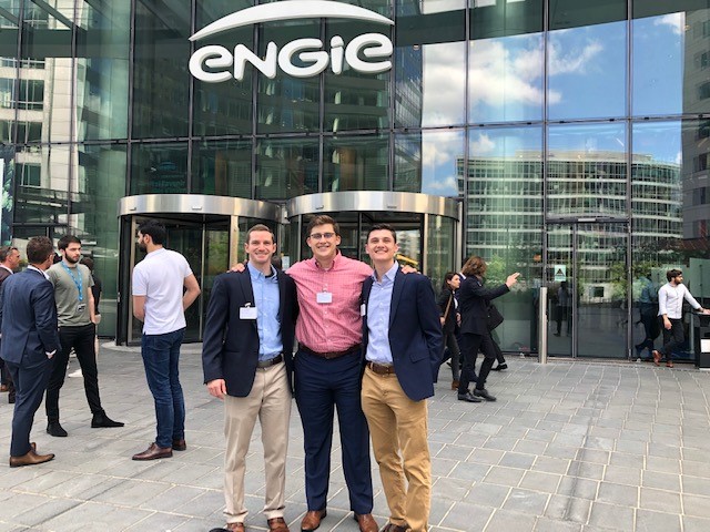 3 students in front of ENGIE headquarters building