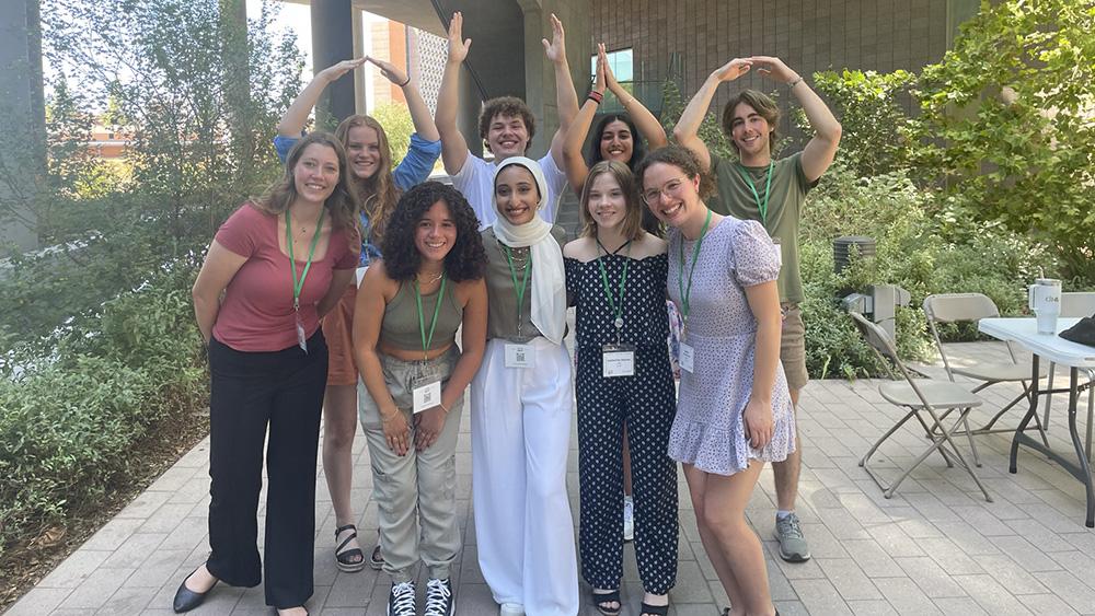 Students posing with arms spelling Ohio