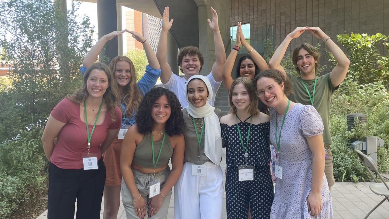 Students spelling Ohio with arms