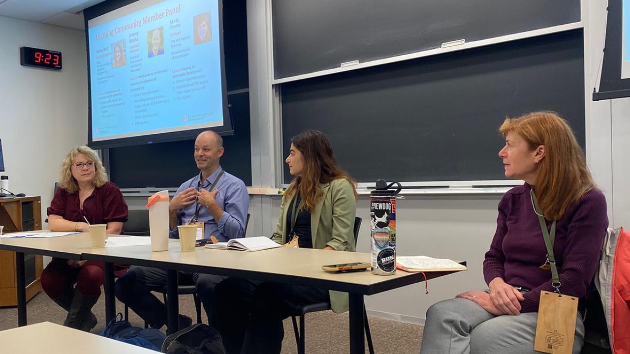 Faculty members speaking on panel