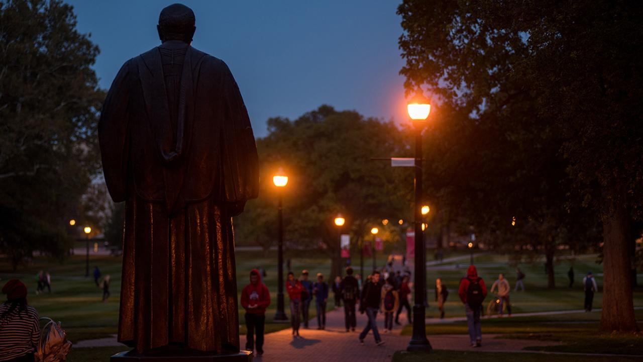 Lampposts lighting Oval at dusk