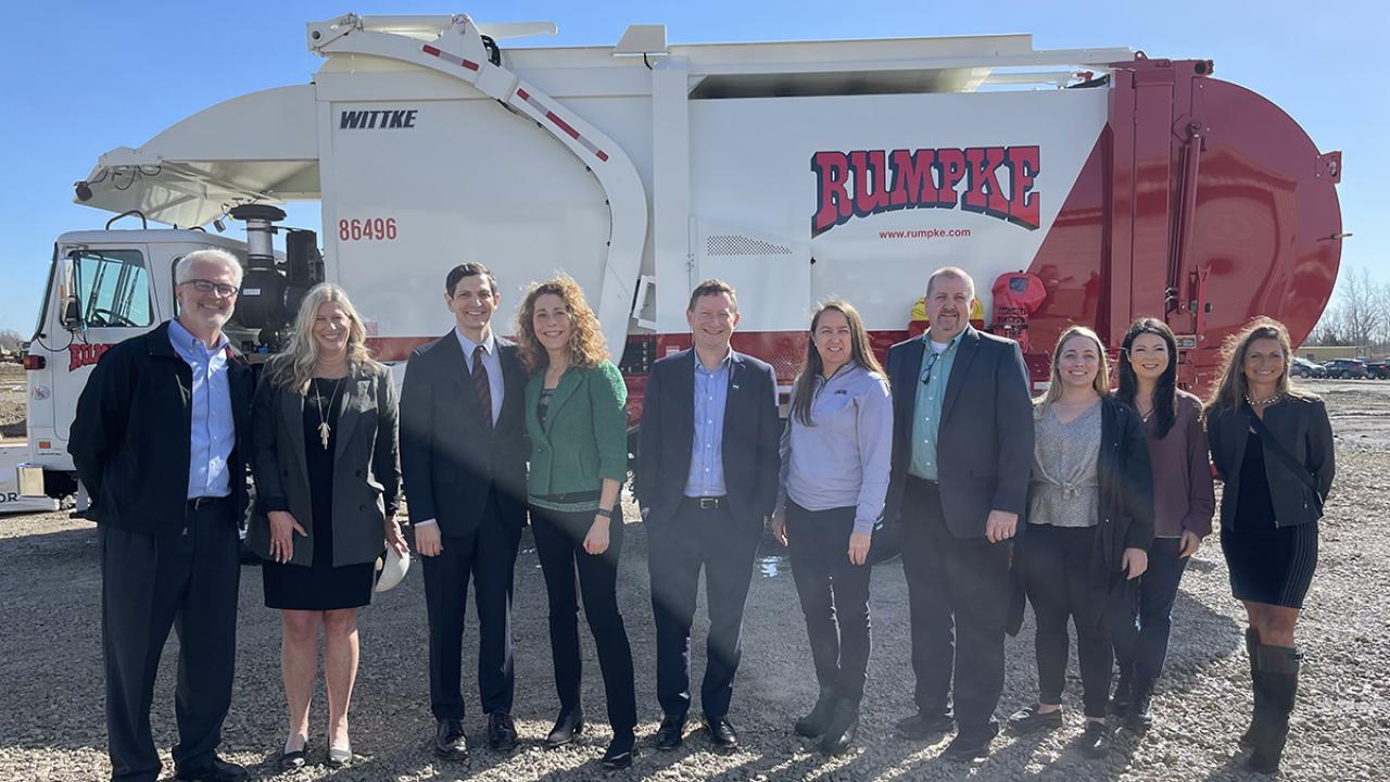 Group photo in front of recycling truck