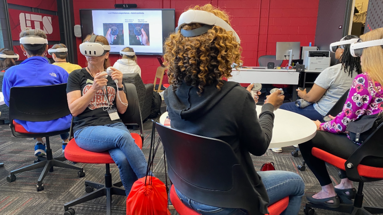 Teachers wearing virtual reality headsets